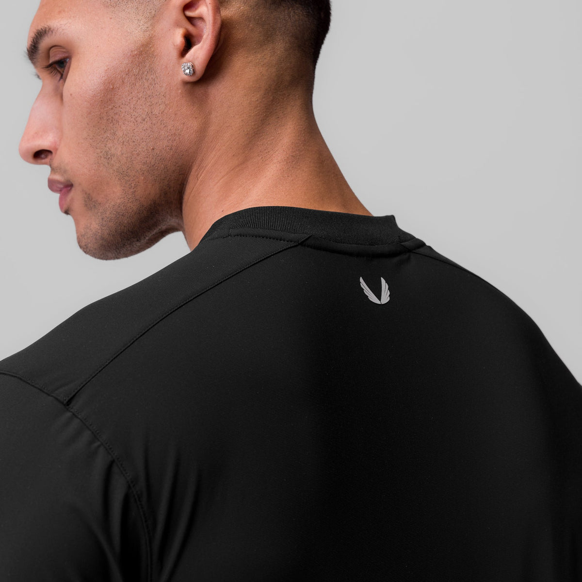 1087. Tetra-Lite® Ice Zip Tee - Black | ASRV