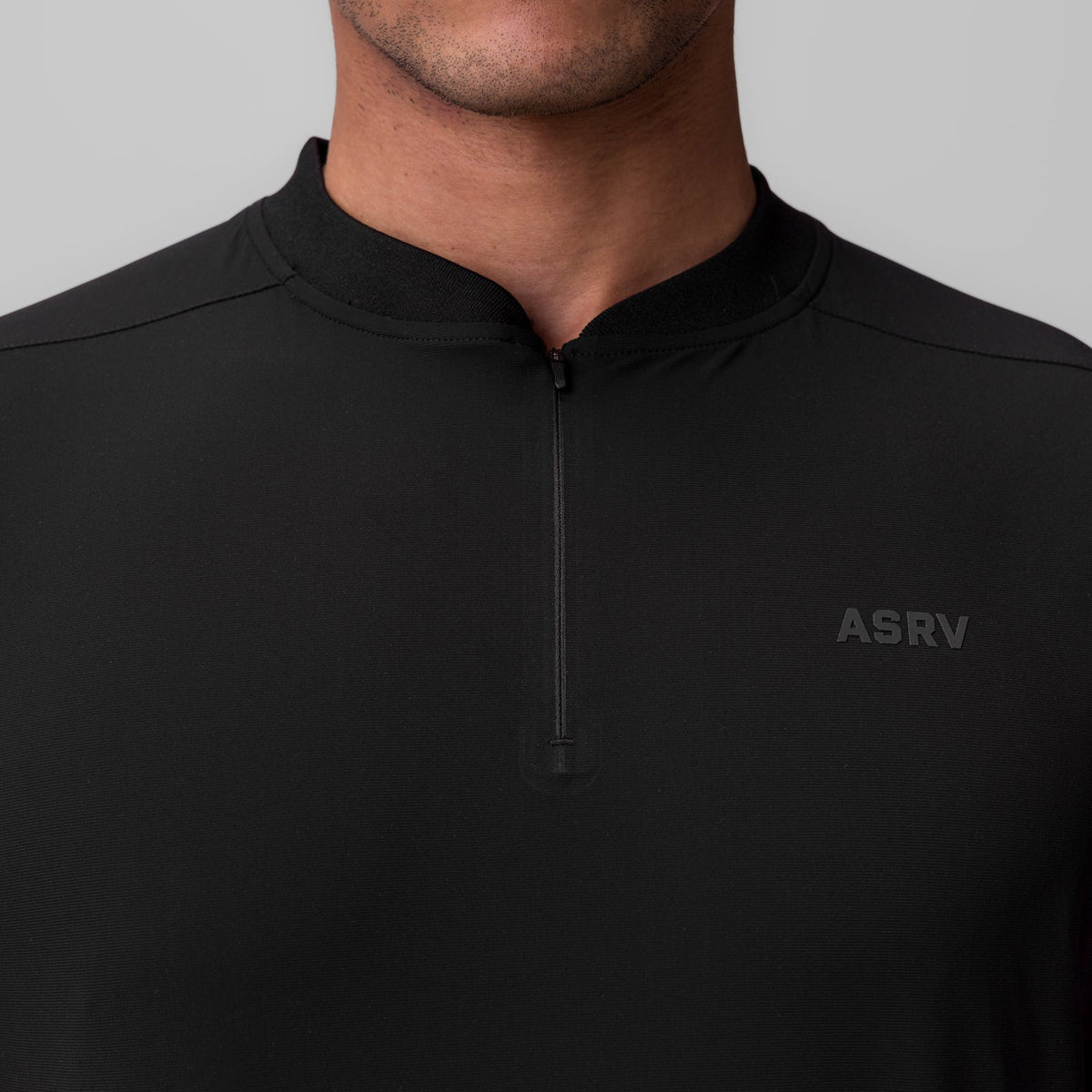 1087. Tetra-Lite® Ice Zip Tee - Black | ASRV