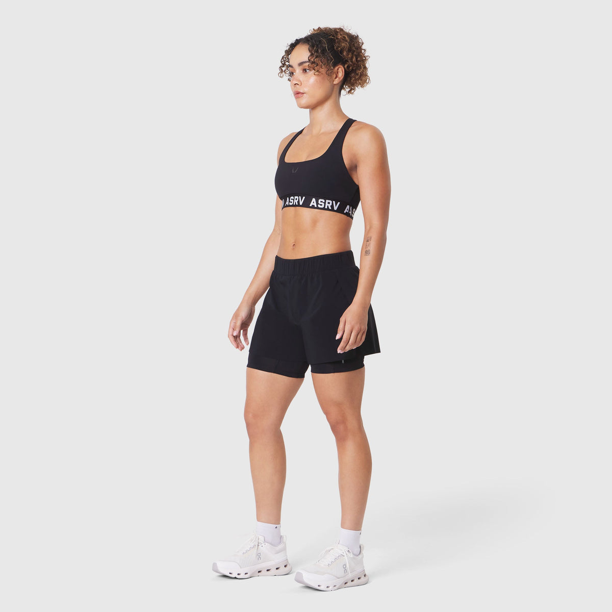 W083. LYCRA® ADAPTIV Racerback Sports Bra - Black | ASRV