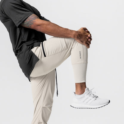 0827. Tetra-Lite® Inlay Pocket High Rib Jogger - Sand Smoke | ASRV